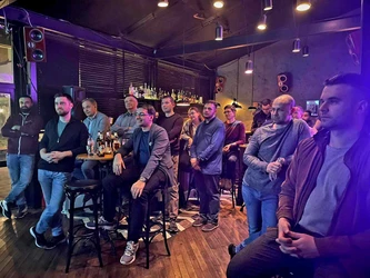 Flags in the sky with a title 'Nearshoring FAQs'